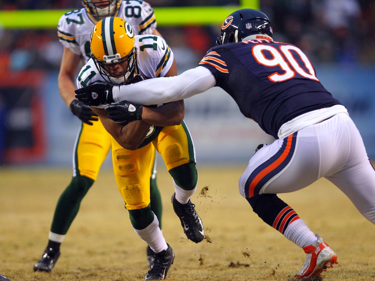 Jarrett Boykin and Julius Peppers were opponents last year but could be starters on this year's Packers team. Photo by Dennis Wierzbicki—USA TODAY Sports.